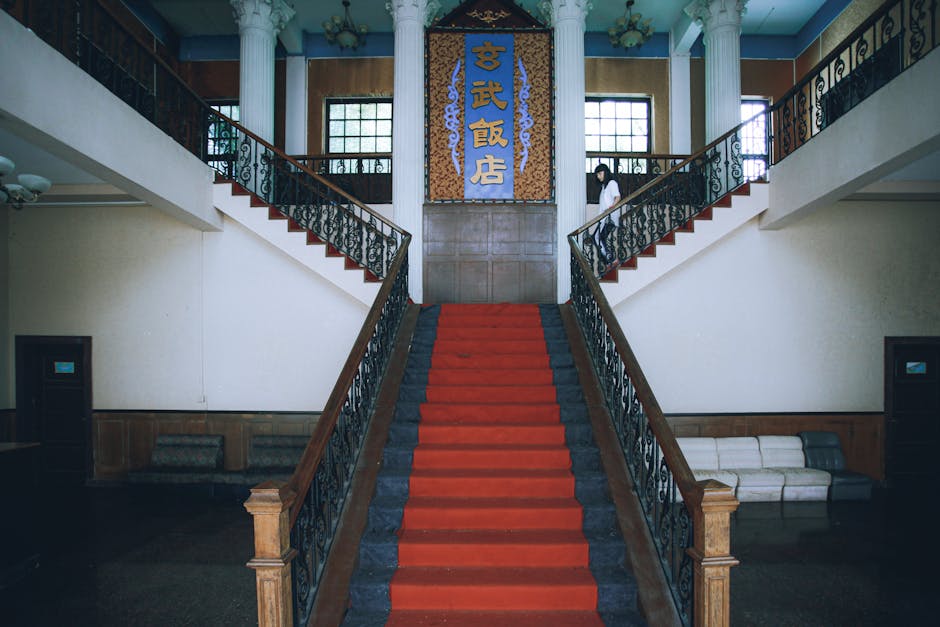 A classic red-carpeted staircase in a vintage interior