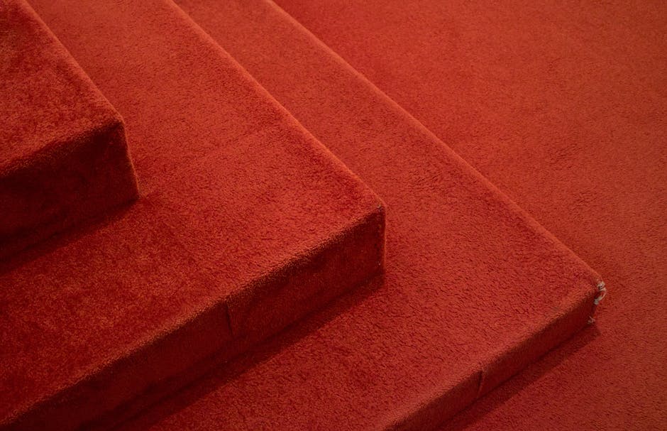 Detailed view of red carpeted stairs